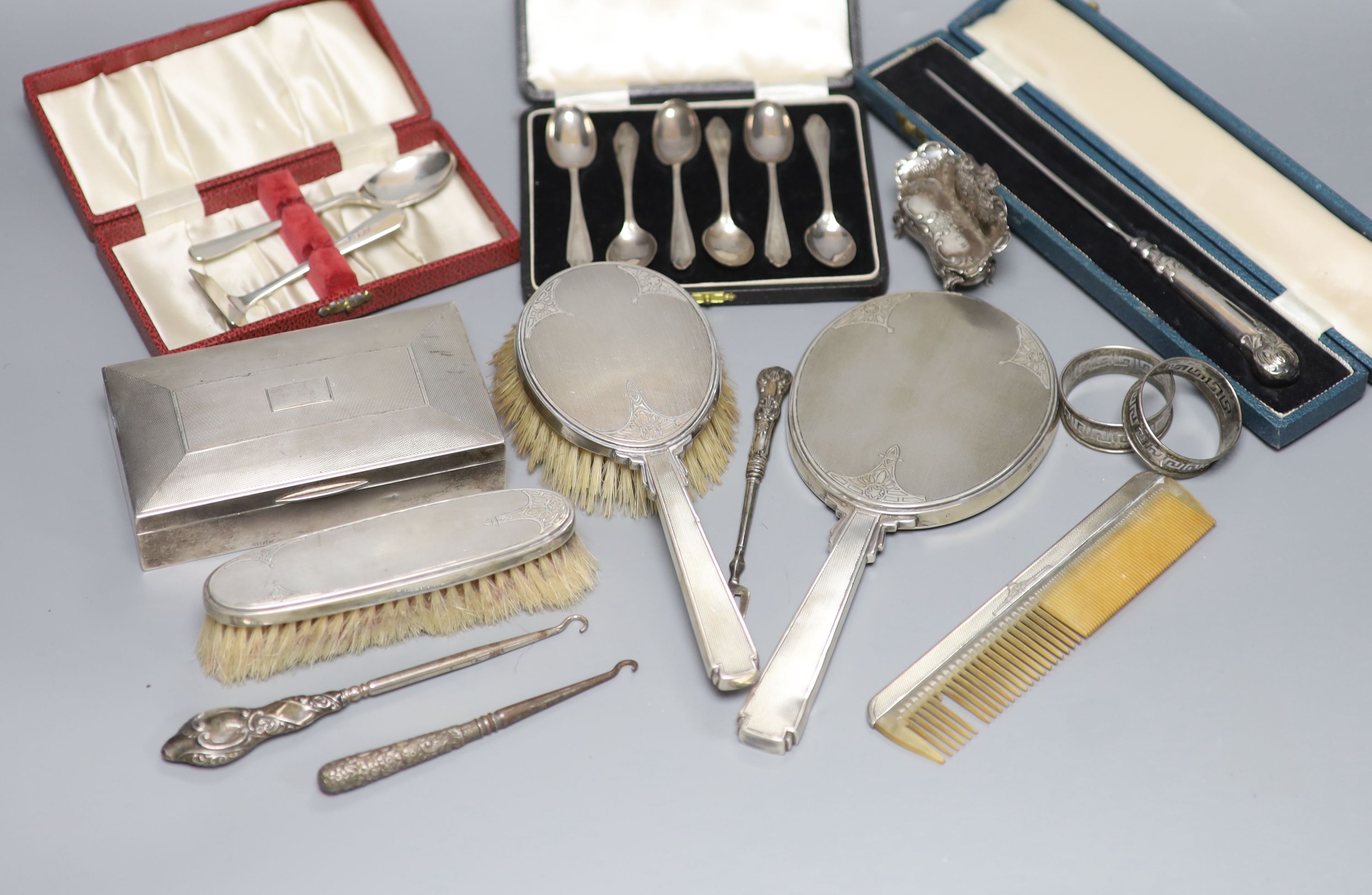 A silver cigarette case, brush set, cased spoons etc and a late Victorian miniature silver settee, Sheffield, 1897.